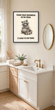 The same print shown hanging in a bathroom — frame for display only, not included