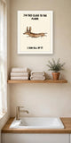 The same print shown hanging in a bathroom — frame for display only, not included