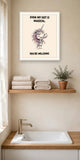 The same print shown hanging in a bathroom — frame for display only, not included