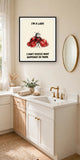 The same print shown hanging in a bathroom — frame for display only, not included