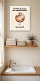 The same print shown hanging in a bathroom — frame for display only, not included