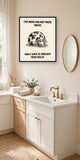 The same print shown hanging in a bathroom — frame for display only, not included
