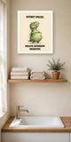 The same print shown hanging in a bathroom — frame for display only, not included