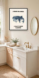 The same print shown hanging in a bathroom — frame for display only, not included