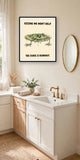 The same print shown hanging in a bathroom — frame for display only, not included