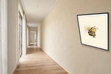 The wordless smug bee print in a black frame on a hallway gallery wall — frame for display only, not included